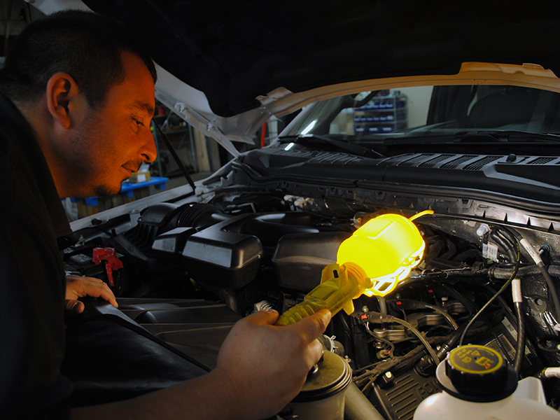 A person working on a car engine