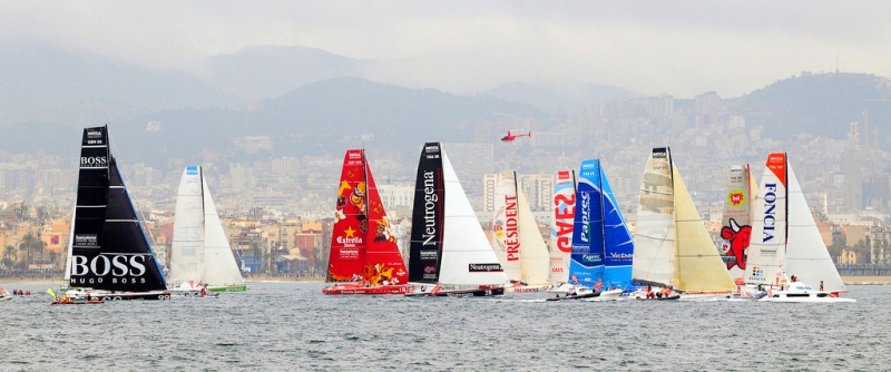 A group of sailboats on the water